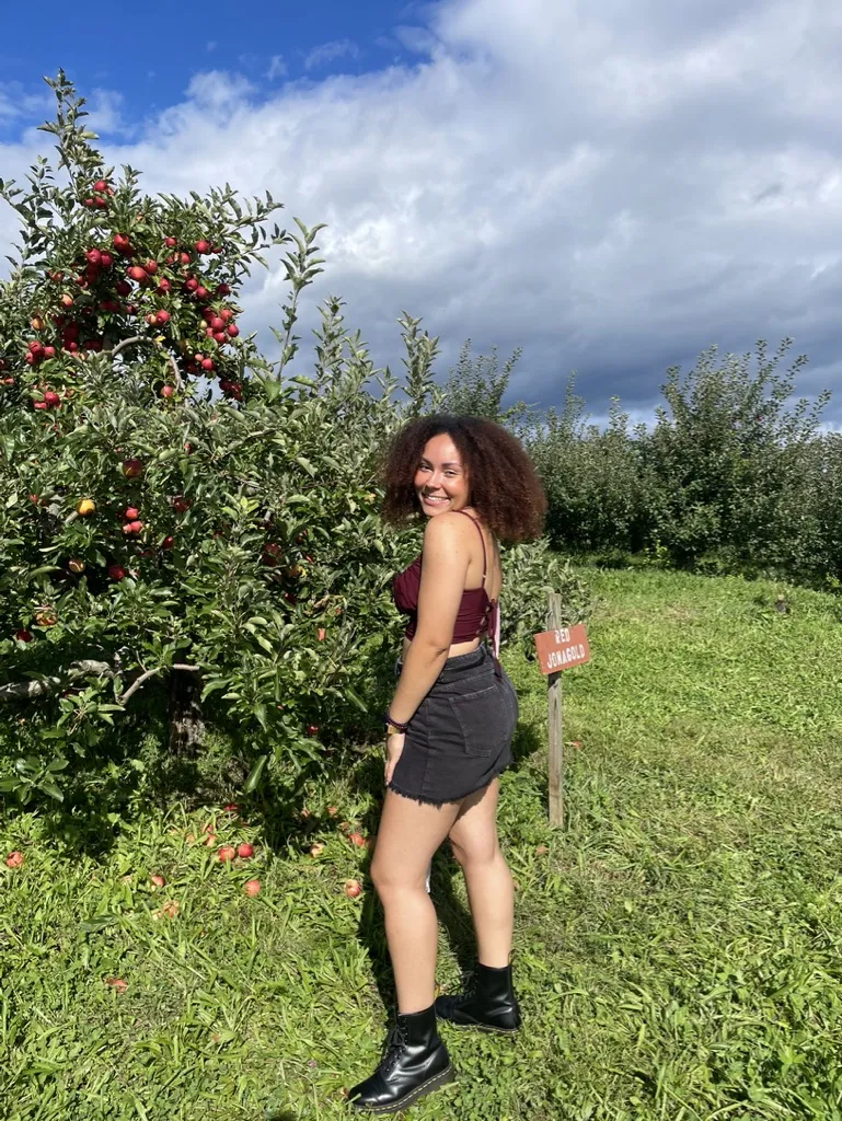  Kiera Collins-Joseph '24 in an apple orchard 