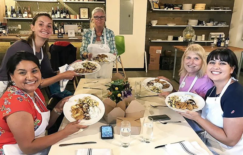 Clockwise from left: Diana Romero Campbell P’21, Anna Dyste ’08, Kathryn Dunn ’75, Susan Greene ’68, and Sofia Campbell ’21 enjoying a cooking class Meredith Badler ’08 and the Smith Club of Colorado and Wyoming organized.