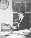 Margaret Grierson with framed lithograph in background