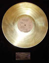 framed gold record I Am Woman by Helen Reddy