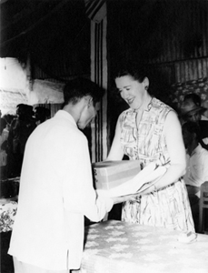 Helen Begley Nixon distributing care packages to Vietnamese refugees, circa 1960s