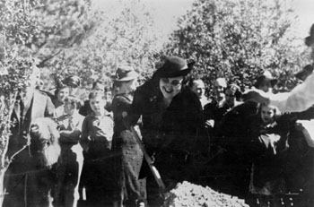 Sophie Friedman planting a tree in celebration of the opening of the Natchez Trail in Natchez, Mississippi; undated