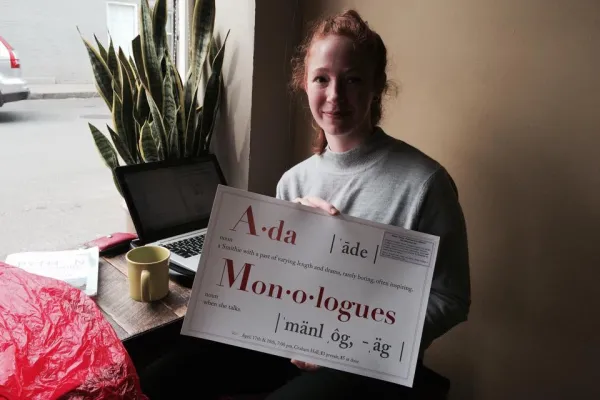 Ada Comstock Scholar Martha Miller holds Ada Monologues poster