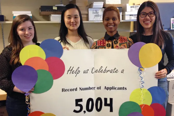 Student workers in the admissions office help celebrate the 2015 record breaking admission numbers