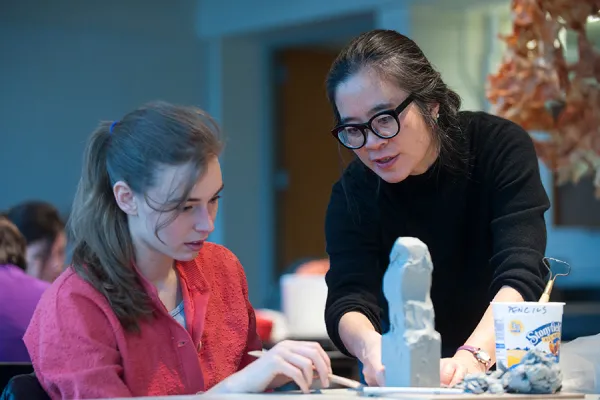 Lynne Yamamoto and a student discussing a sculpture project