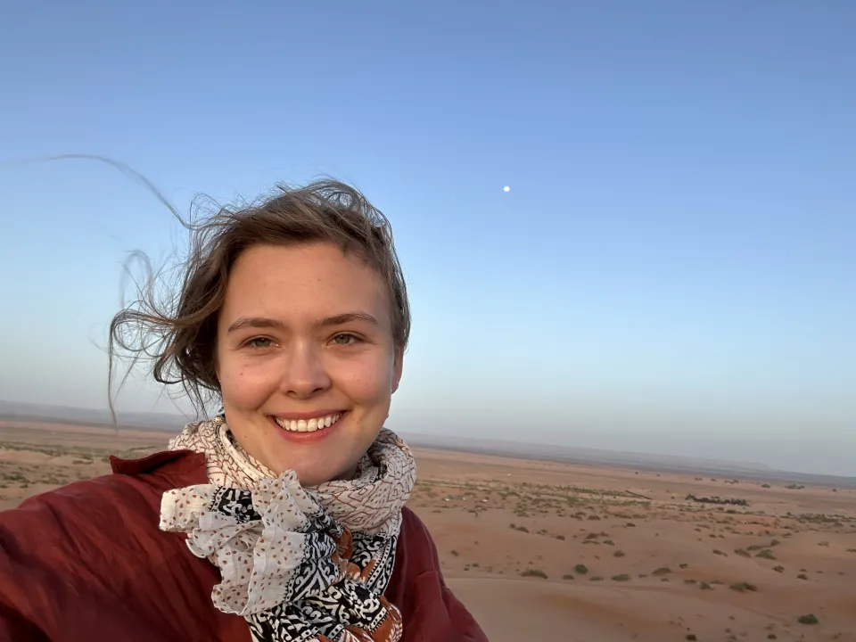 Elizabeth Peters ‘24 against a blue and desert background
