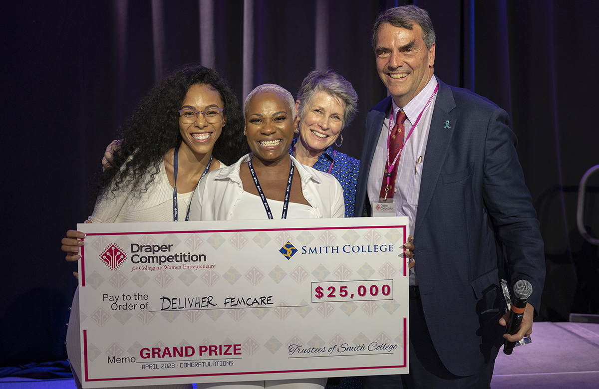 Entrepreneurs Dia Davis and Chanté Knox, who won the first-place prize for DelivHer FemCare, with competition founders, Melissa and Tim Draper.  