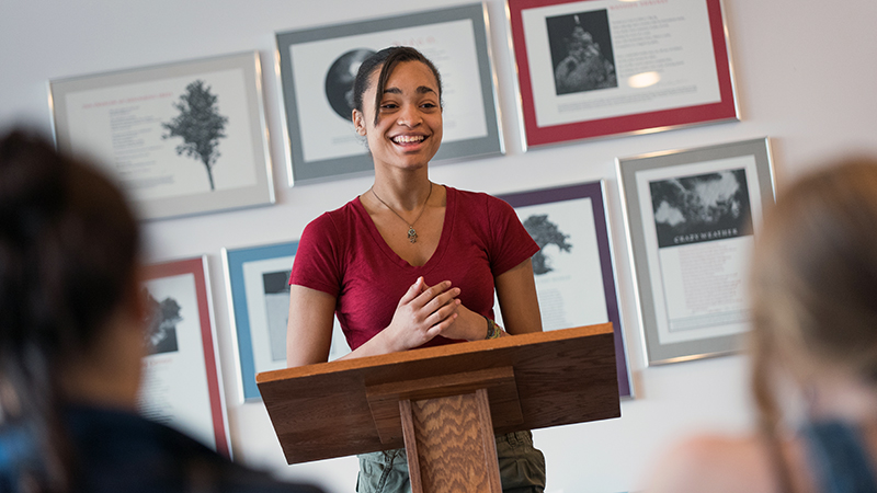 A student at the podium in the poetry center