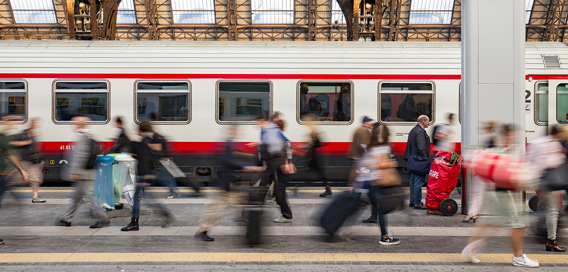 Commuters in a hurry on a train platform