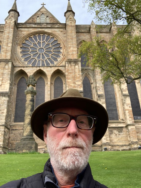Joel Kaminsky in front of rosette window at Durham Cathedral