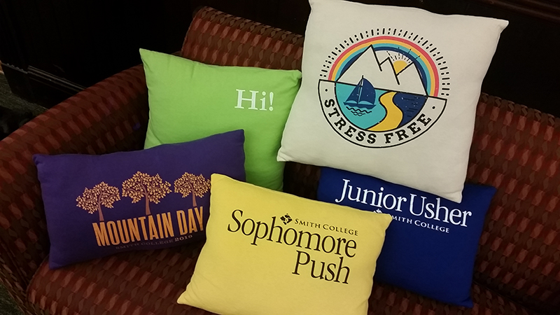 Photo of colorful insignia pillows at the class deans office