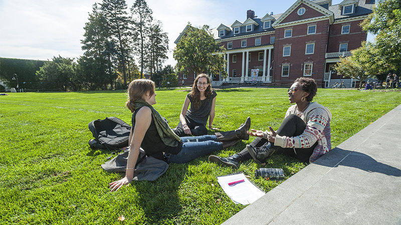 A group of students sitting on the lawn