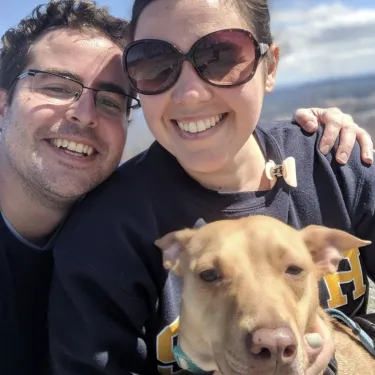 Christie Kennedy with her husband and dog.