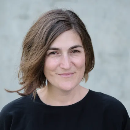 Headshot of Miciah Bay Gault smiling against a plain light background.