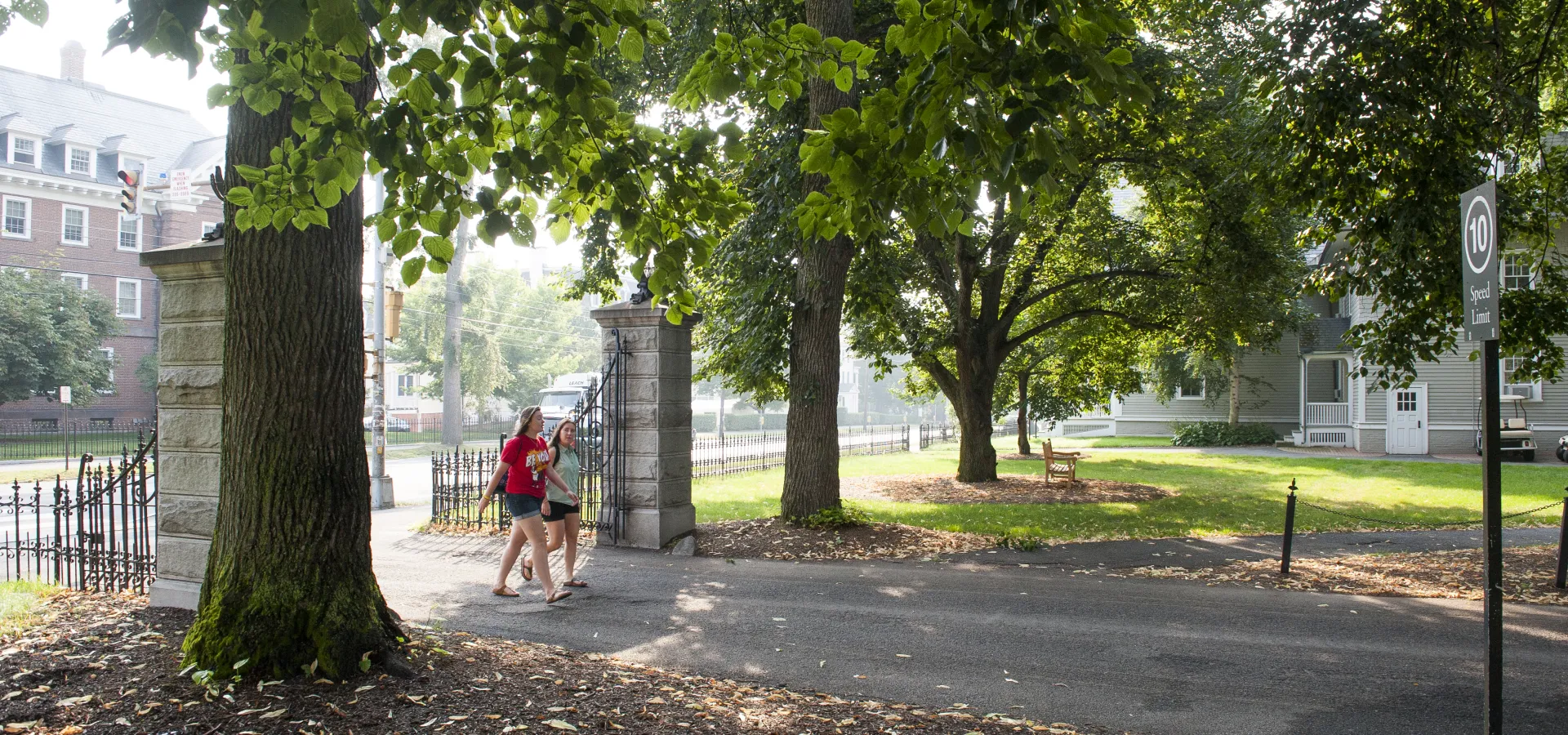 Two students walking on to campus.