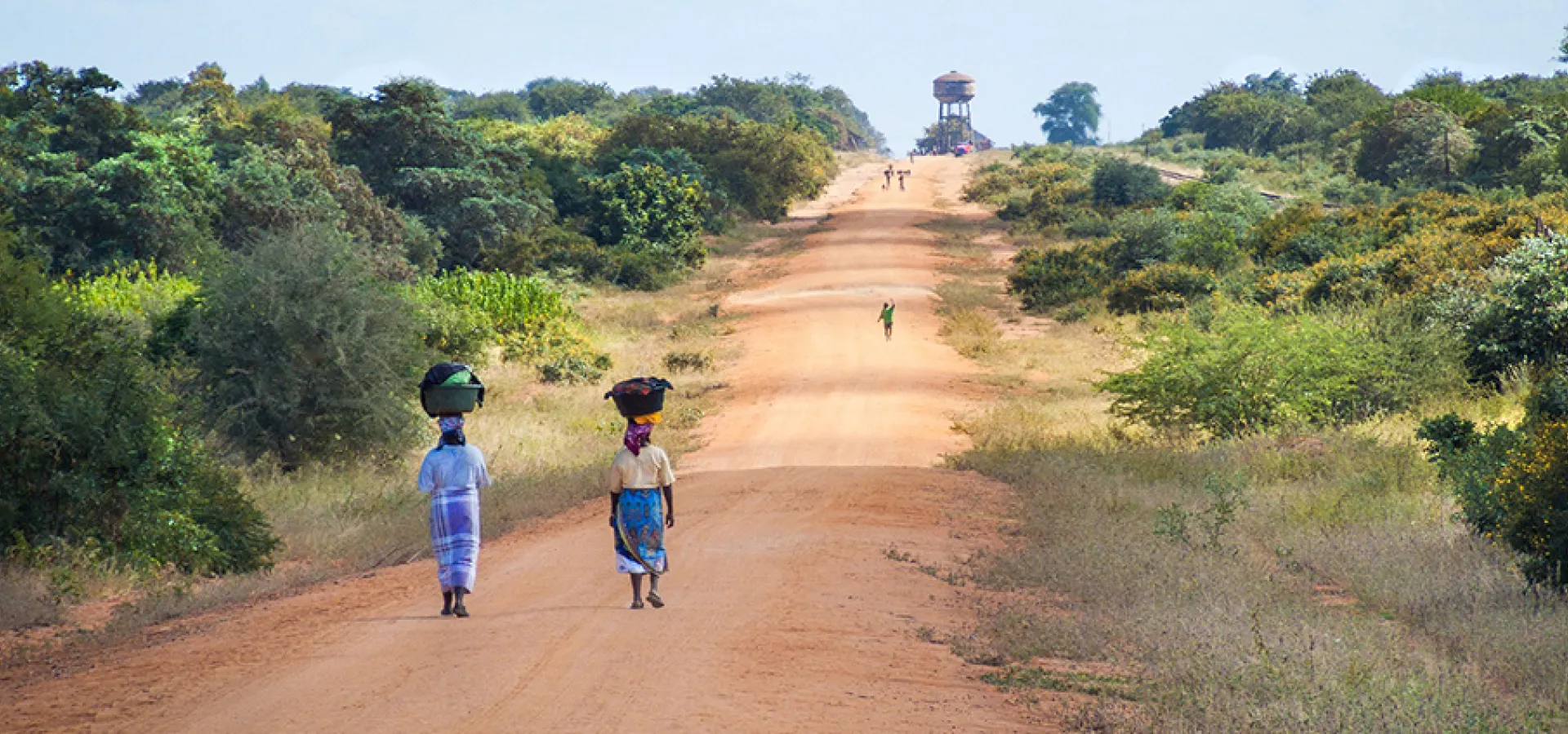 African women walking on a road