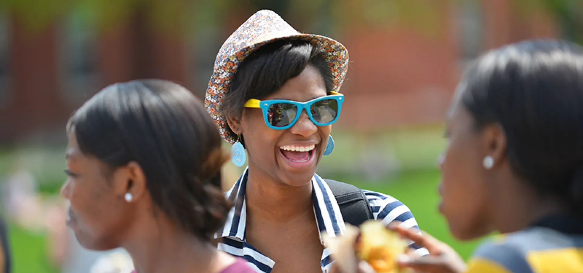Student in a summer hat and sunglasses