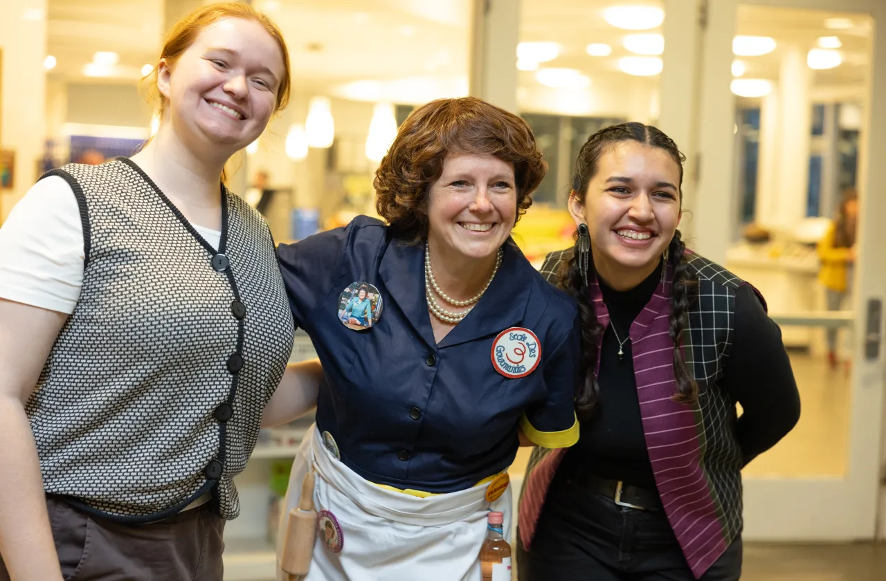 Tina Atkinson poses with students while dressed as Julia Child
