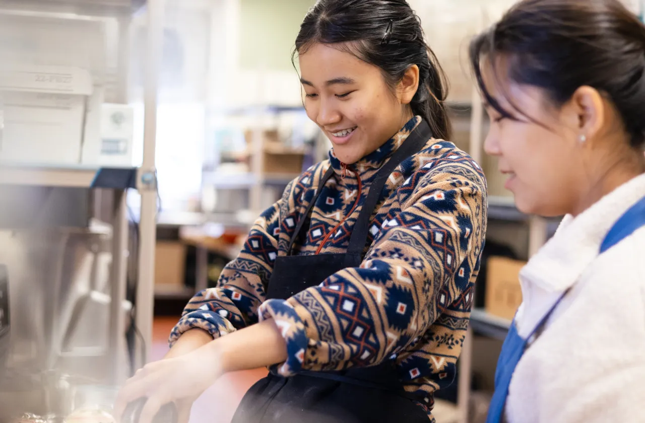 international students prepare dishes for IS Day 2025