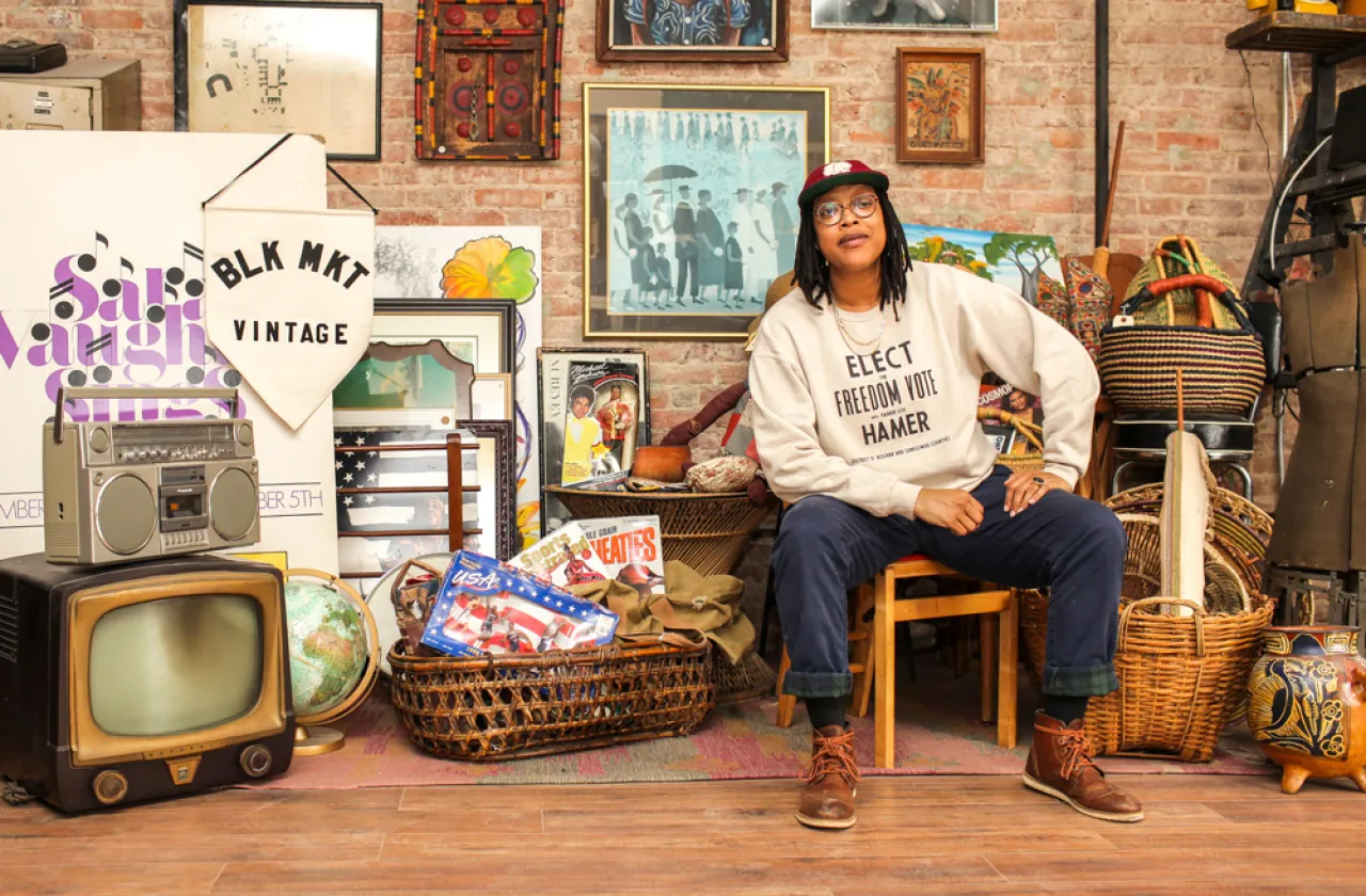 Jannah Handy in her store BLK MKT Vintage, surrounded by African American historical items