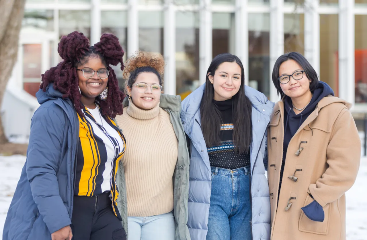 Four students outside the Smith campus center