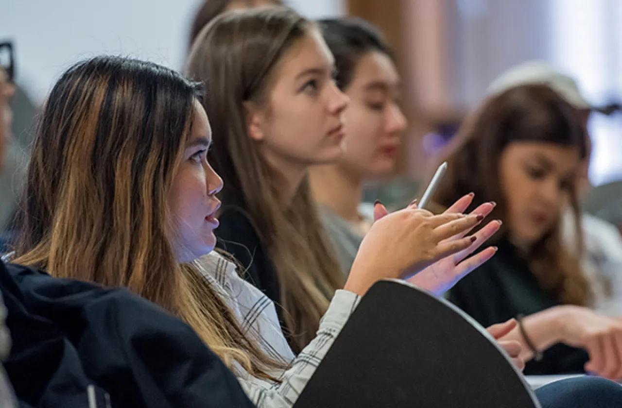 Students in auditorium facing forward