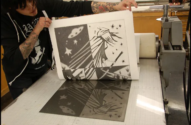 Cassie Leone '16 printing an etching in Advanced Printmaking