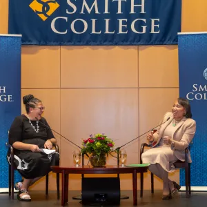 President Sarah Willie-LeBreton on stage with Lynnette Watkins during her presidential colloquium.