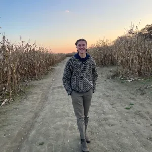 Pria Parker ’25 in a cornfield at sunset