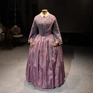 A photo of an old dress on a mannequin