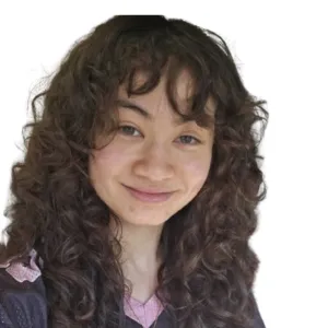 Headshot of Lillian Brickman with long, curly dark hair smiling gently against a plain white background.