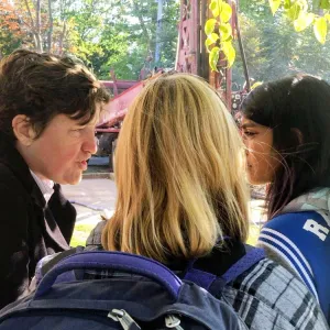 Denise McKahn with students in front of a drill rig
