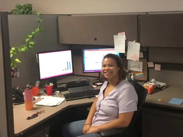 Madison Williams in a cubicle