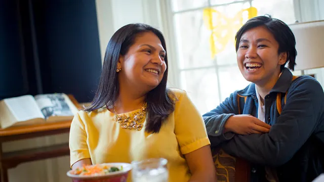Two students in a dining hall