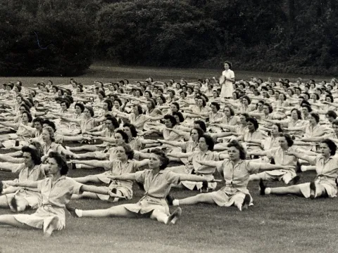 ranks of women doing stretches