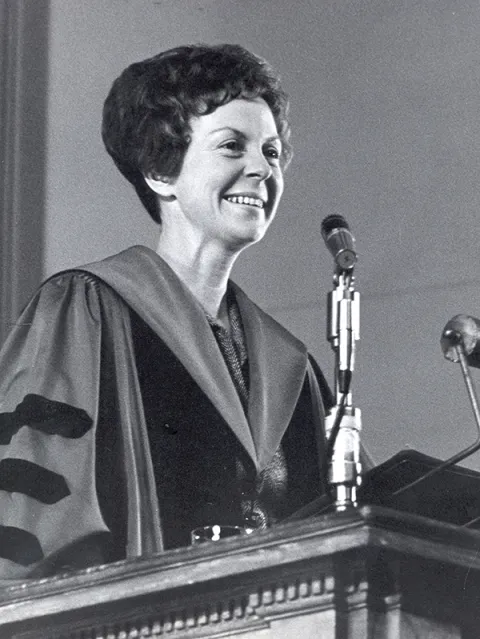 Jill Conway speaking at a podium