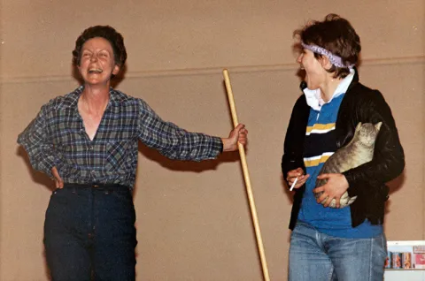 Jill Conway on stage with a student
