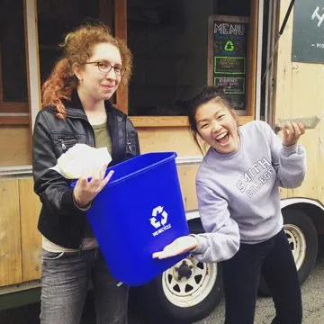 Laura Lilienkamp '18 (left) and Leigh Johnston '18 were among 320 Smithies who exchanged unwanted items for treats during this year's move-out.