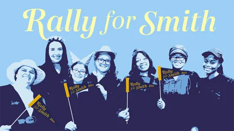 Rally for Smith - a stylized photo shows a row of students or alums in graduation regalia holding Rally for Smith 2022 banners