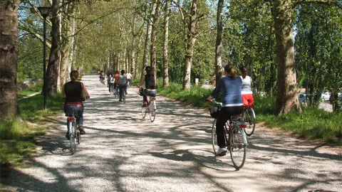 Students riding bikes in Italy
