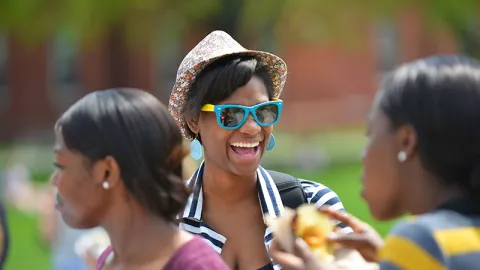 Student in a summer hat and sunglasses