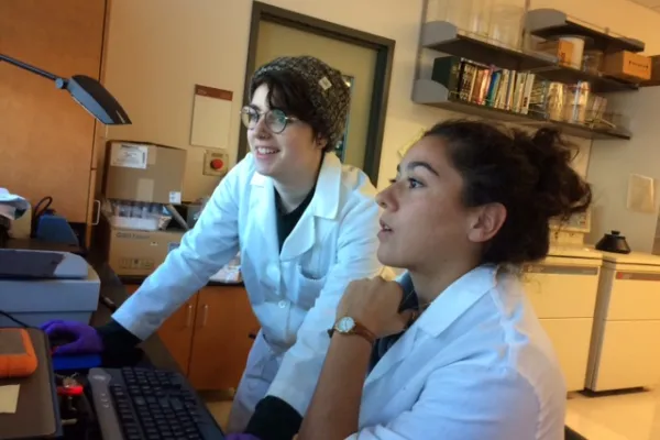 Emily Morris '19 and Maggie Pacheco '19 review data on a computer screen