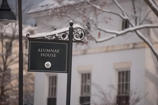 alumnae house sign with snow