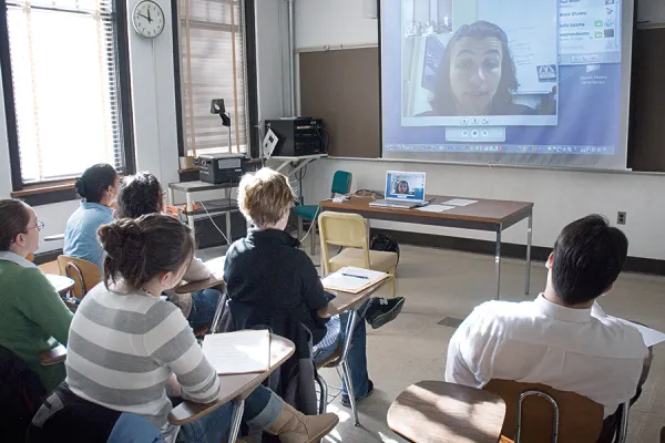 Student in a classroom participating in a web conference