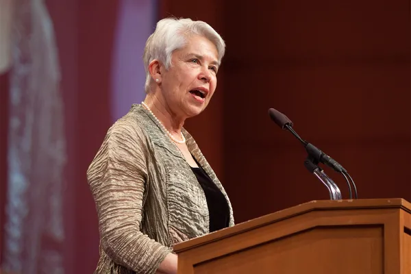 Carol Christ speaking at a podium