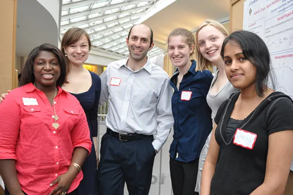 Five students and a faculty member in the Campus Center