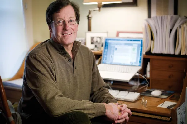 Eric Reeves at a desk