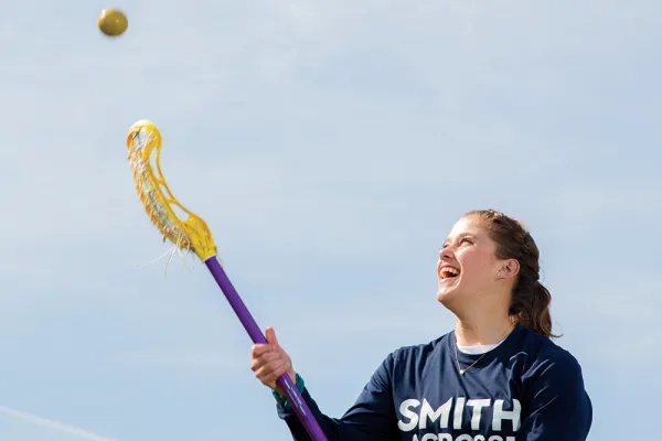 Jessica Lindquist tossing a ball in the air