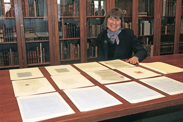 Karen Kukil, associate curator for special collections at Smith, surveys 12 letters from Sylvia Plath '55 that were recently donated to the college. Photo by Isabella Casini '17.