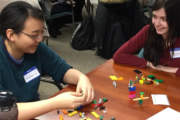 Julieanna Niu '16 (left) and Bailey Vaillancourt '16 play with Legos during a recent workshop for this year's Smith engineering Design Clinic capstone course.